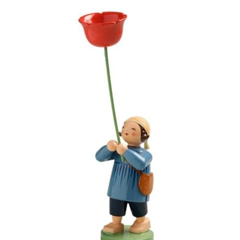 Junge mit Mohnblume