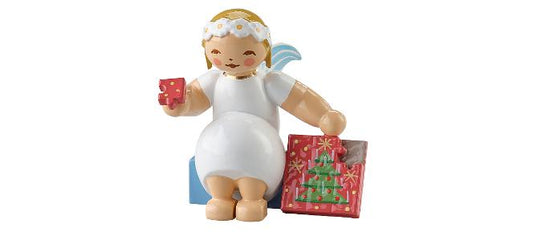 Margeritenengel mit Puzzle, sitzend